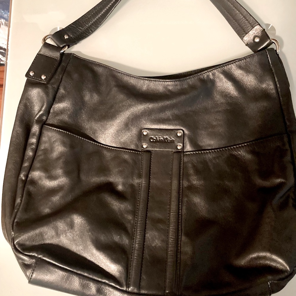 Calvin Klein Smooth Black Napa Leather Shoulder Purse with Silver Satin Lining.